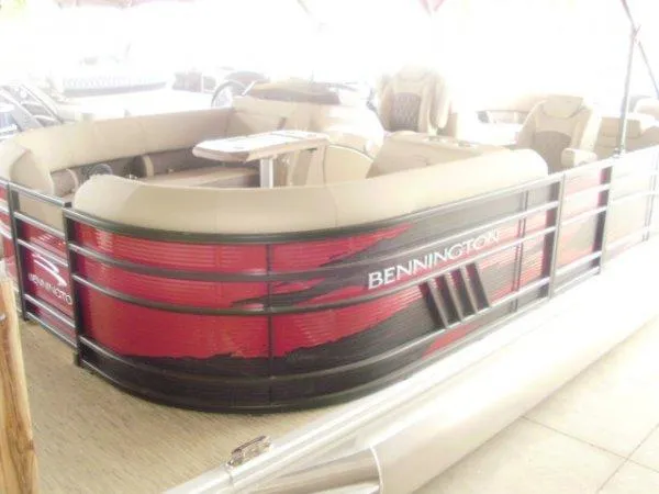 Slide: The Image of 2023 Bennington 22LFB pontoon boat with red and black exterior. - 1
