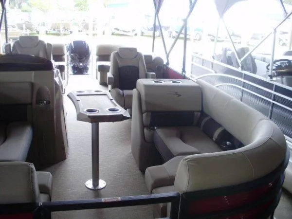 Slide: The Image of 2023 Bennington 22LFB pontoon boat interior with luxurious seating and table. - 5