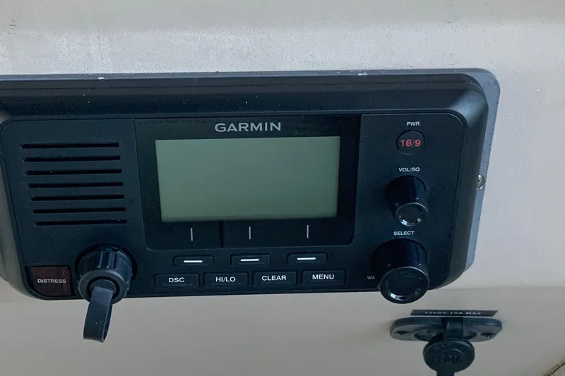 Slide: The Image of Garmin marine radio on 2000 Sea Ray Sundancer boat dashboard. - 12