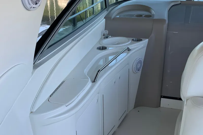 Slide: The Image of 2000 Sea Ray Sundancer interior with sink and storage cabinets. - 5