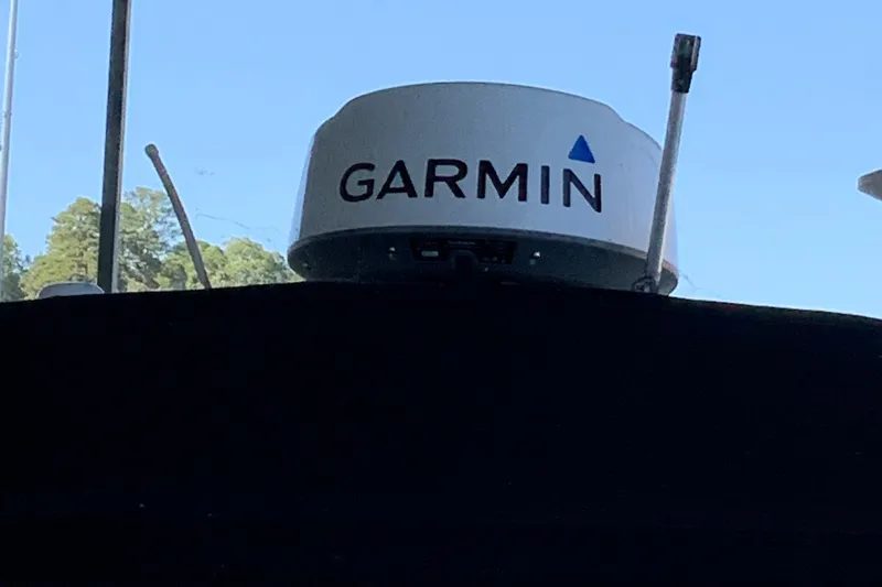 Slide: The Image of Garmin radar on a 2000 Sea Ray Sundancer boat against a clear blue sky. - 6