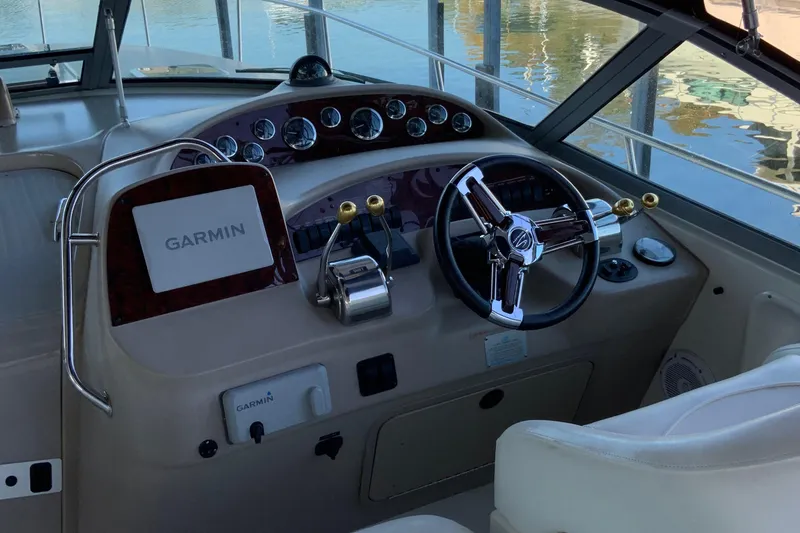 Slide: The Image of Cockpit of 2000 Sea Ray Sundancer with Garmin navigation system and steering wheel. - 8