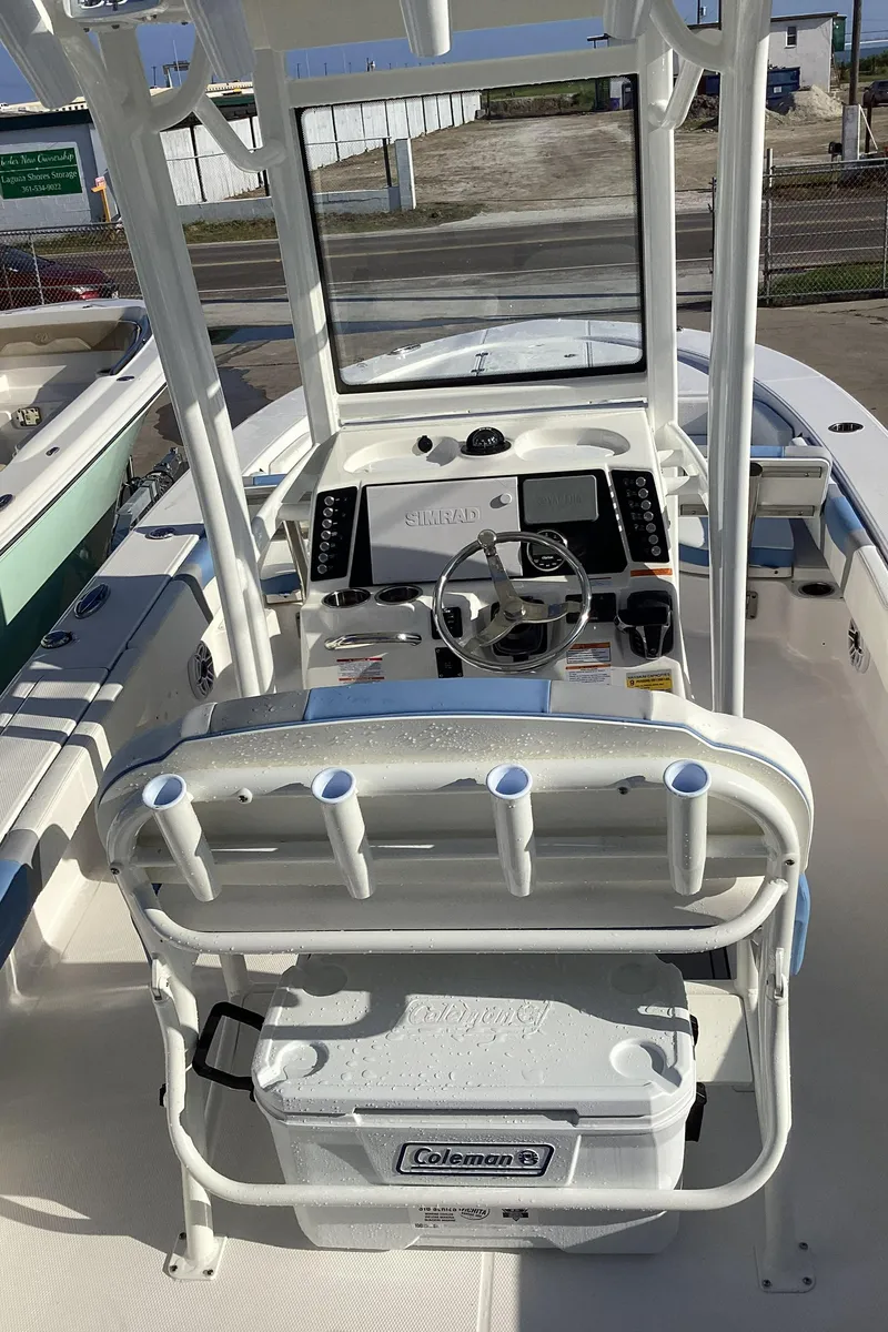 Slide: The Image of 2023 Robalo 246 Cayman center console boat interior with Coleman cooler. - 5