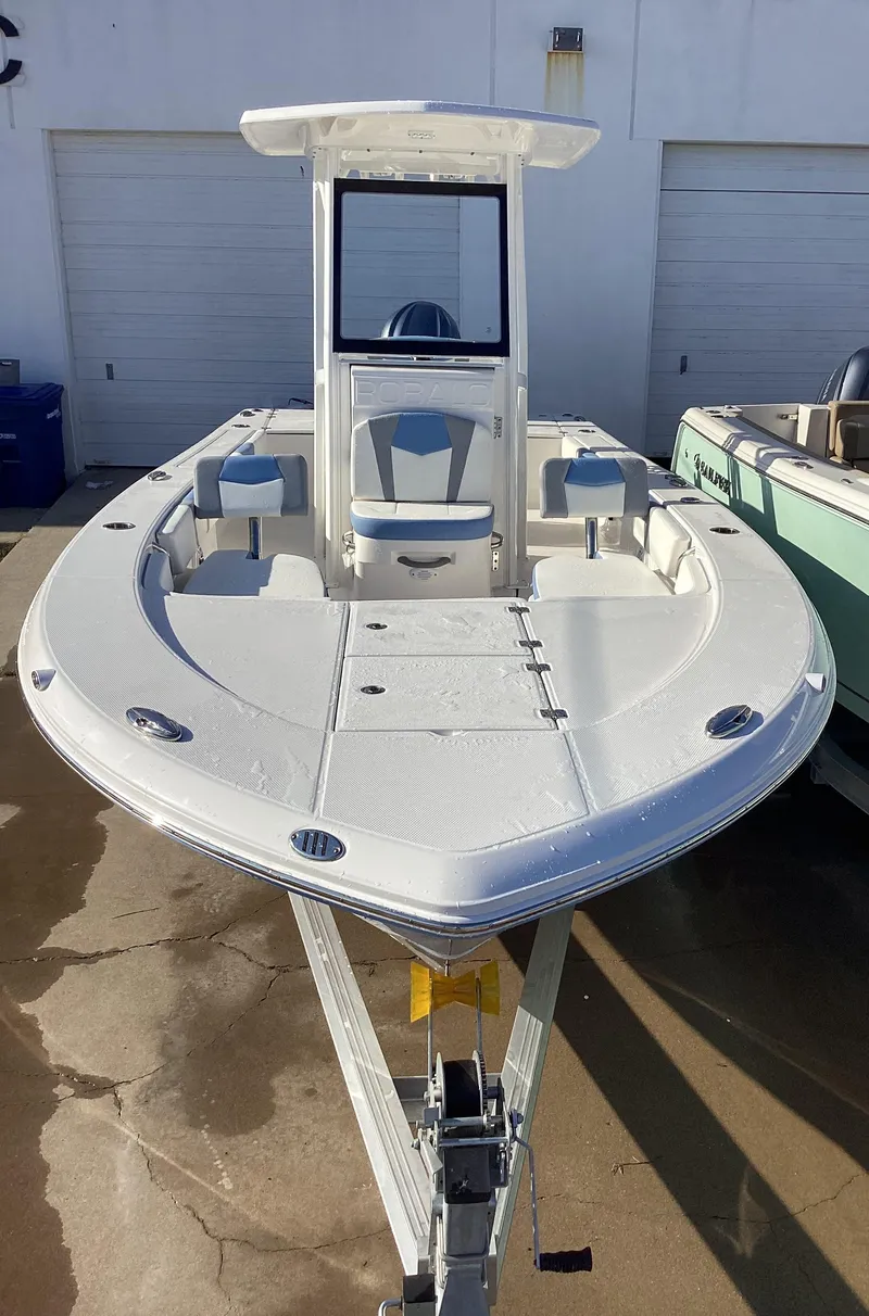Slide: The Image of 2023 Robalo 246 Cayman boat on trailer, front view. - 6