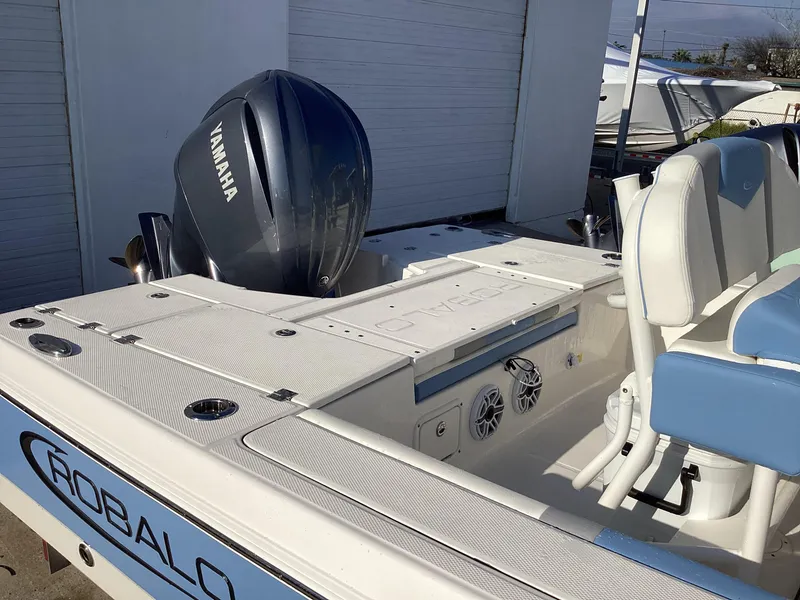 Slide: The Image of 2023 Robalo 246 Cayman boat with Yamaha engine, rear deck view. - 9