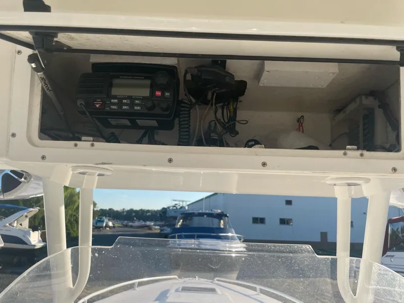 Slide: The Image of 2005 Marlago 35 boat electronics compartment with radio. - 13