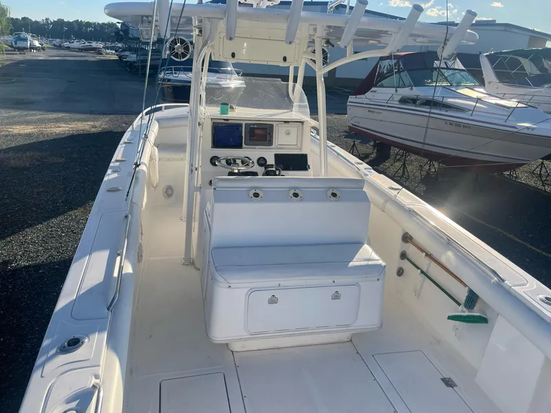 Slide: The Image of 2005 Marlago 35 boat interior, helm station and seating area. - 2