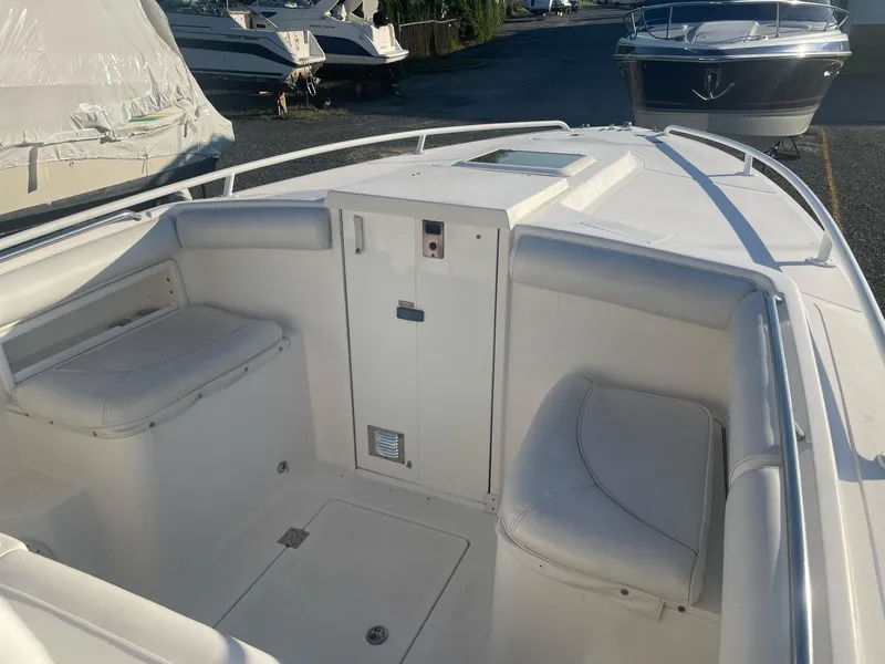 Slide: The Image of Interior view of a 2005 Marlago 35 boat with white seating. - 4