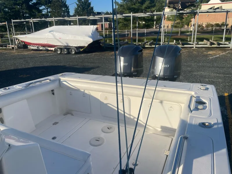 Slide: The Image of Rear view of a 2005 Marlago 35 boat with dual outboard motors. - 9