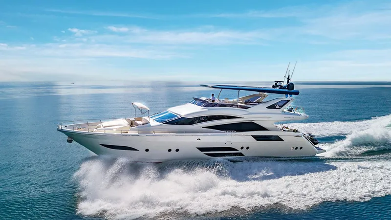 Slide: The Image of Luxurious 2015 Dominator 800 yacht cruising on open sea under clear blue sky. - 1