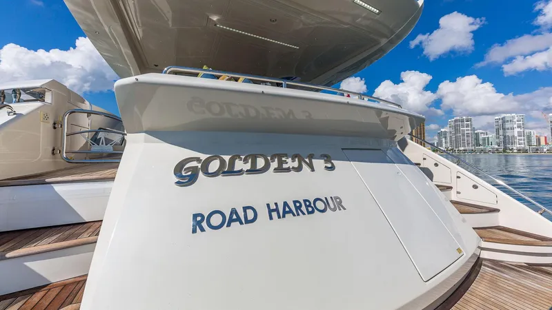 Slide: The Image of Luxury yacht "Golden 3" at Road Harbour, Dominator 800, 2015 model, docked under blue sky. - 16