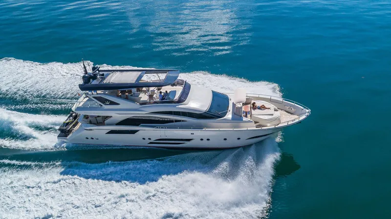 Slide: The Image of Luxurious 2015 Dominator 800 yacht cruising on clear blue waters. - 3