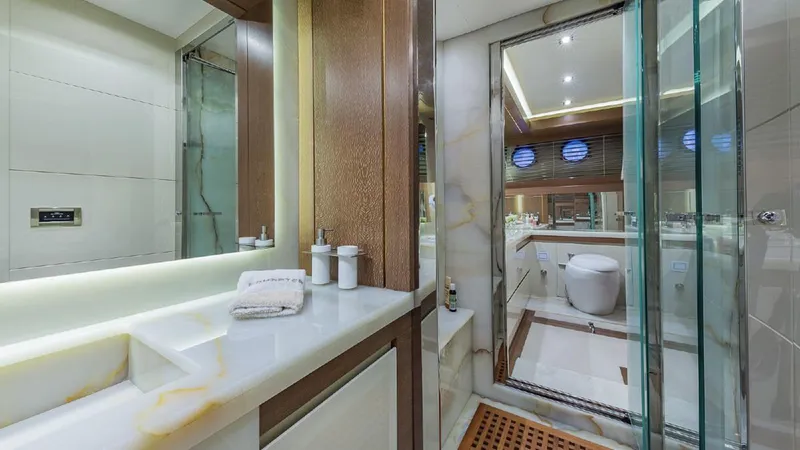 Slide: The Image of Luxurious yacht bathroom with modern fixtures, glass shower, and elegant wood accents, Dominator 800, 2015. - 30