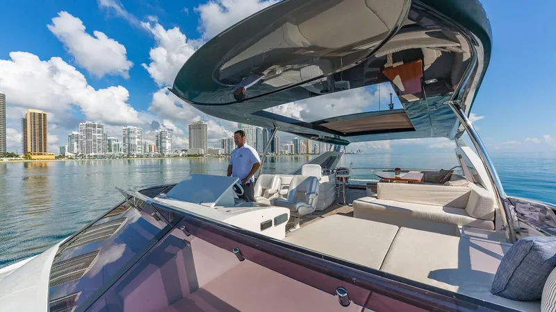Slide: The Image of Luxurious 2015 Dominator 800 yacht cruising near city skyline on a sunny day. - 6
