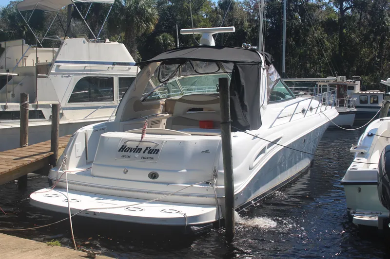 Slide: The Image of 1999 Sea Ray 410 Express Cruiser docked, rear view, "Havin Fun" in Inglis, Florida. - 2