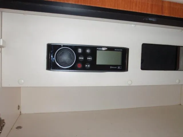 Slide: The Image of 1999 Sea Ray 410 Express Cruiser stereo system in cabin compartment. - 22