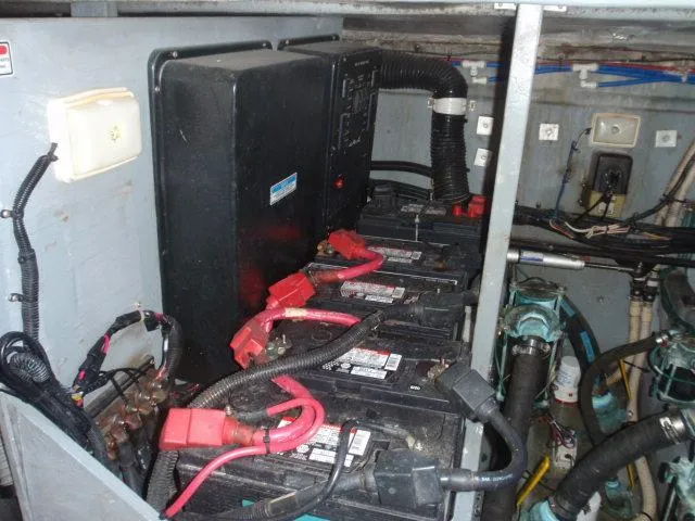 Slide: The Image of Engine room of 1999 Sea Ray 410 Express Cruiser with battery setup. - 41