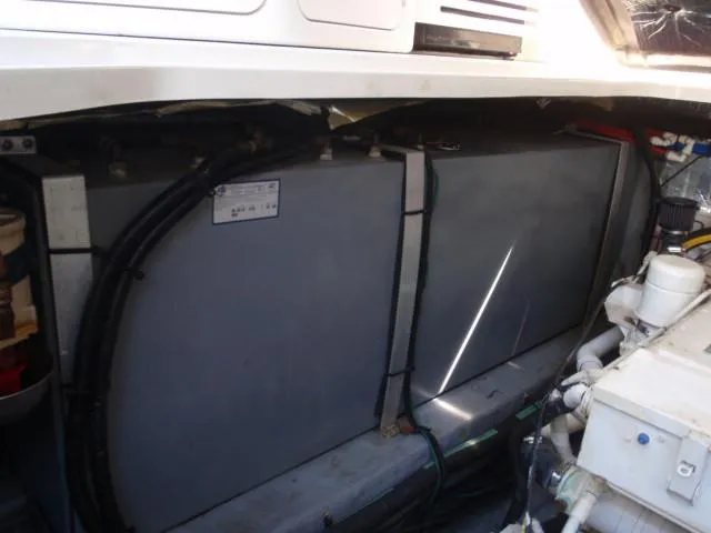 Slide: The Image of Engine compartment of 1999 Sea Ray 410 Express Cruiser, showing fuel tanks and machinery. - 43
