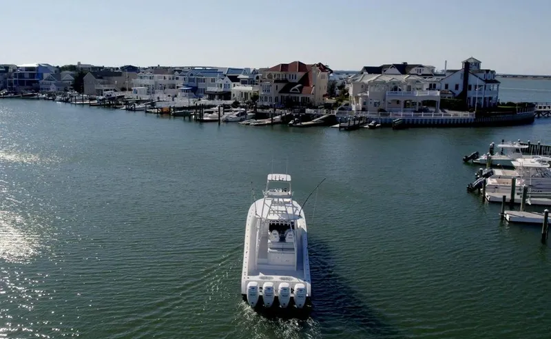 Slide: The Image of Aerial view of a 2021 Conch 47 boat in a coastal marina setting. - 10