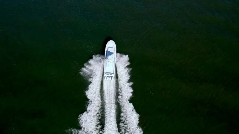 Slide: The Image of Aerial view of 2021 Conch 47 boat cruising on open water. - 16