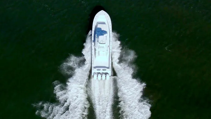 Slide: The Image of Aerial view of 2021 Conch 47 boat speeding on water. - 17