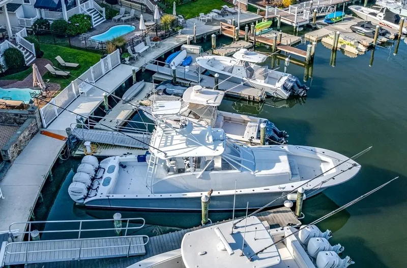 Slide: The Image of Aerial view of a 2021 Conch 47 boat docked in a marina. - 20