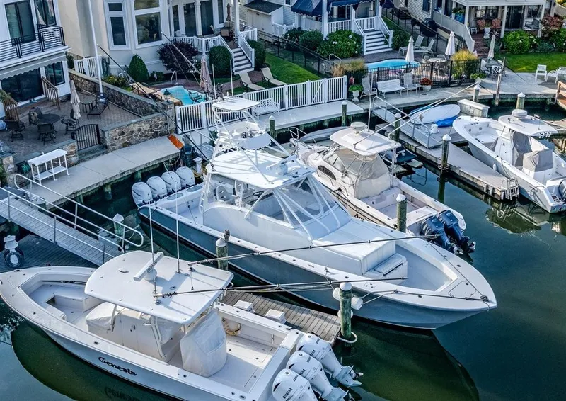 Slide: The Image of Aerial view of a 2021 Conch 47 boat docked in a marina. - 21