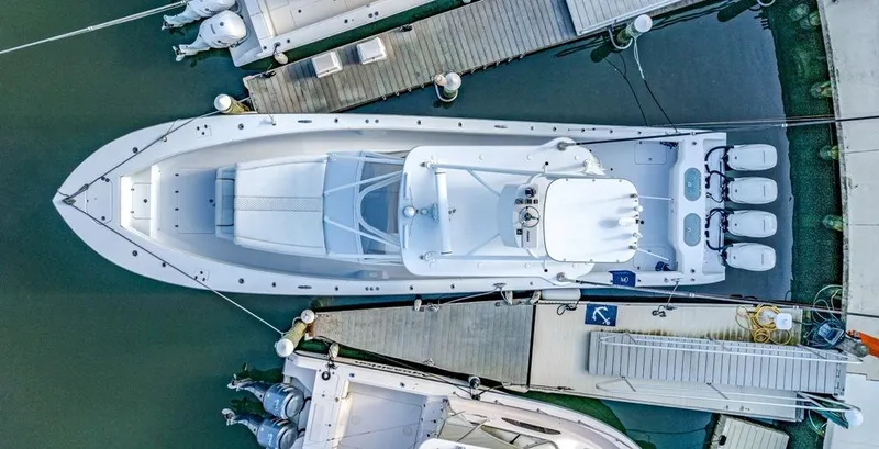 Slide: The Image of Aerial view of a 2021 Conch 47 boat docked at a marina. - 24
