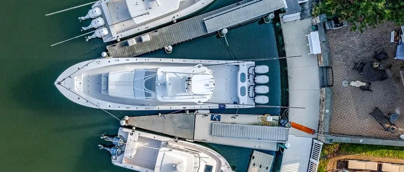 Slide: The Image of Aerial view of a 2021 Conch 47 yacht docked at a marina. - 25