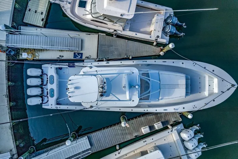 Slide: The Image of Aerial view of a 2021 Conch 47 boat docked at a marina. - 26