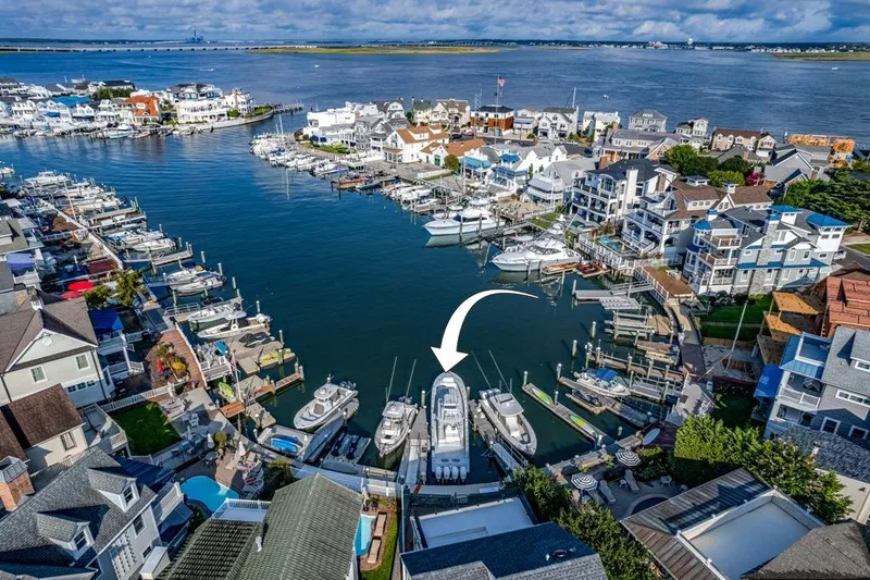 Slide: The Image of Aerial view of a marina with a 2021 Conch 47 boat highlighted. - 29