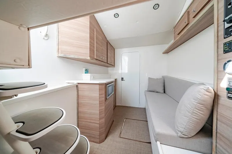 Slide: The Image of Modern interior of 2021 Conch 47 boat with sleek kitchen and cozy seating area. - 36