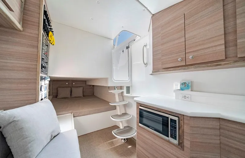 Slide: The Image of Modern interior of 2021 Conch 47 boat with cozy seating and kitchenette. - 37