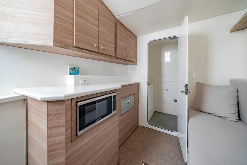 Slide: The Image of Modern interior of 2021 Conch 47 boat with kitchenette and seating area. - 38