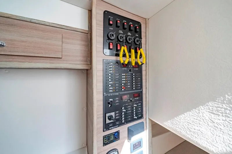 Slide: The Image of Electrical control panel in a 2021 Conch 47 boat interior. - 41