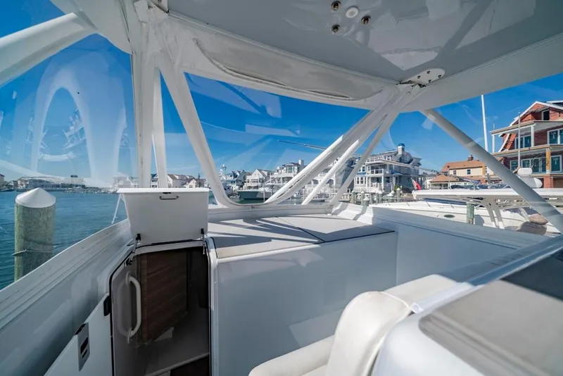Slide: The Image of Interior view of a 2021 Conch 47 boat docked at a marina. - 44