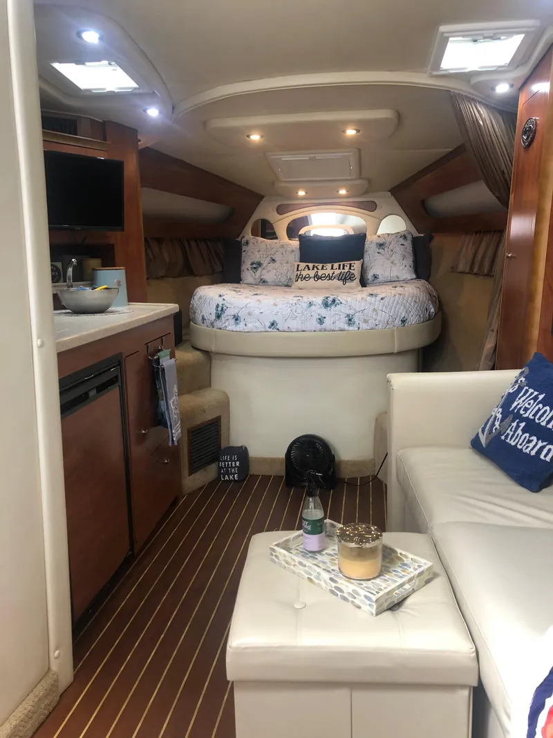 Slide: The Image of Interior of 2007 Rinker 350 Express Cruiser with cozy bed and modern amenities. - 11