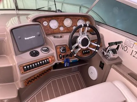 Slide: The Image of 2007 Rinker 350 Express Cruiser helm with steering wheel and control panel. - 14