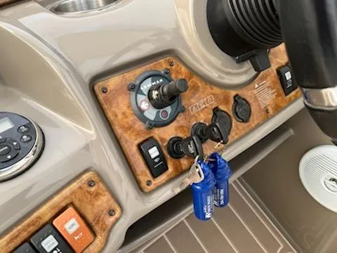 Slide: The Image of Control panel of a 2007 Rinker 350 Express Cruiser boat with keys. - 15