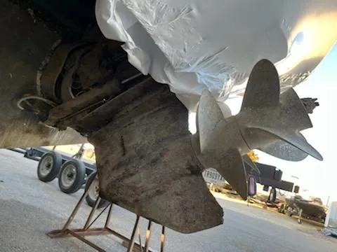 Slide: The Image of Close-up of 2007 Rinker 350 Express Cruiser propeller and stern drive on a trailer. - 17