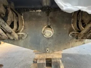 Slide: The Image of Bottom view of a 2007 Rinker 350 Express Cruiser on wooden blocks. - 19