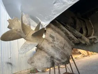 Slide: The Image of Close-up of a 2007 Rinker 350 Express Cruiser's propeller and stern drive. - 20