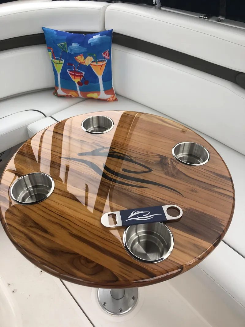 Slide: The Image of Wooden table with cup holders on 2007 Rinker 350 Express Cruiser, colorful cocktail pillow. - 5