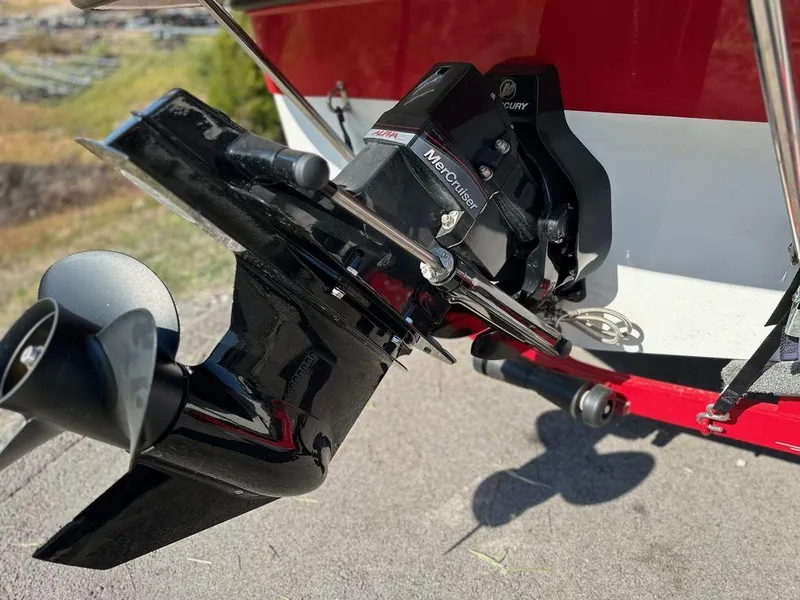 Slide: The Image of 2015 Ebbtide 176 SE Bow Rider boat with MerCruiser outdrive, red and white exterior. - 6