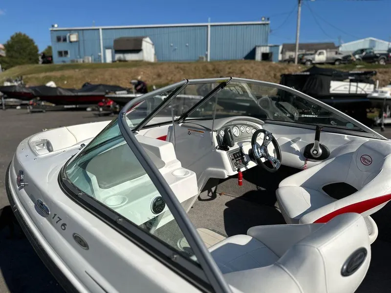 Slide: The Image of 2015 Ebbtide 176 SE Bow Rider boat with white interior and steering wheel. - 8