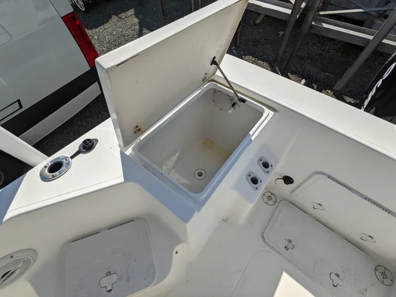 Slide: The Image of 2007 Sea Boss 235 Center Console boat interior with open storage compartment. - 14