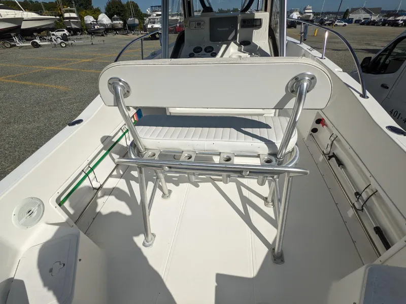 Slide: The Image of 2007 Sea Boss 235 Center Console boat interior with seating and control panel. - 16