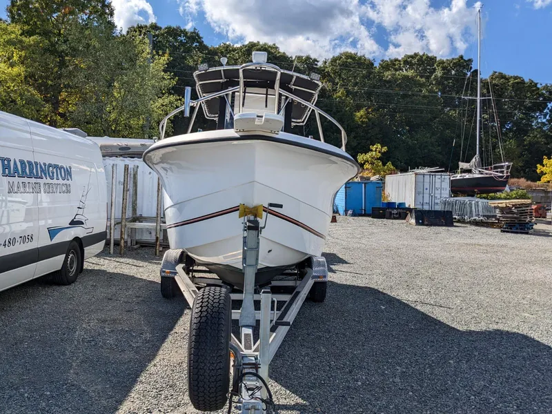 Slide: The Image of 2007 Sea Boss 235 Center Console boat on trailer in a marina yard. - 5