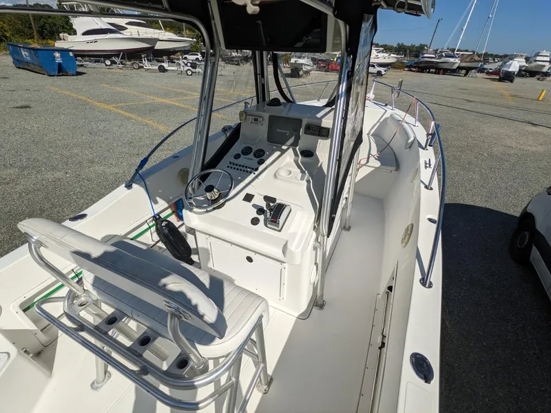 Slide: The Image of 2007 Sea Boss 235 Center Console boat interior with steering console and seating. - 7