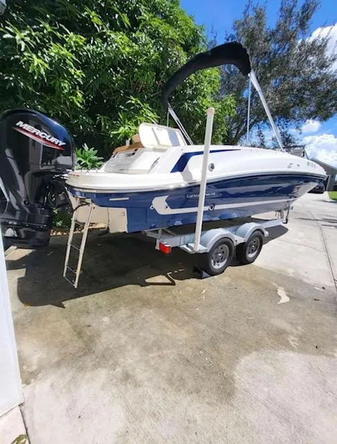 Slide: The Image of 2021 Bayliner VR6 Bowrider OB on trailer with Mercury outboard motor. - 3
